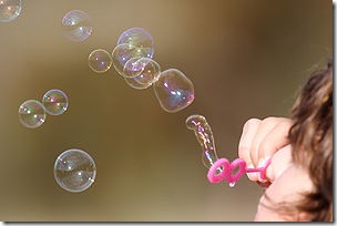 300px-Girl_blowing_bubbles
